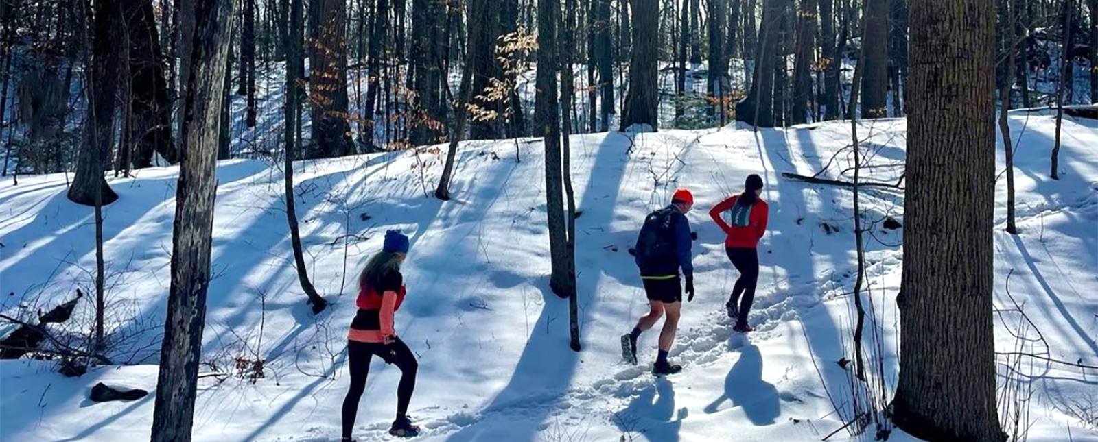 Three people hiking through the winter snow (Instagram@hippiepreppybobohomegirl)