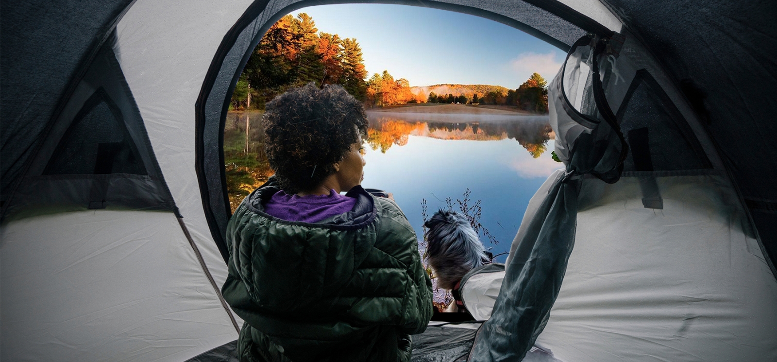 Woman looking out of her tent overlooking Black Rock State Park