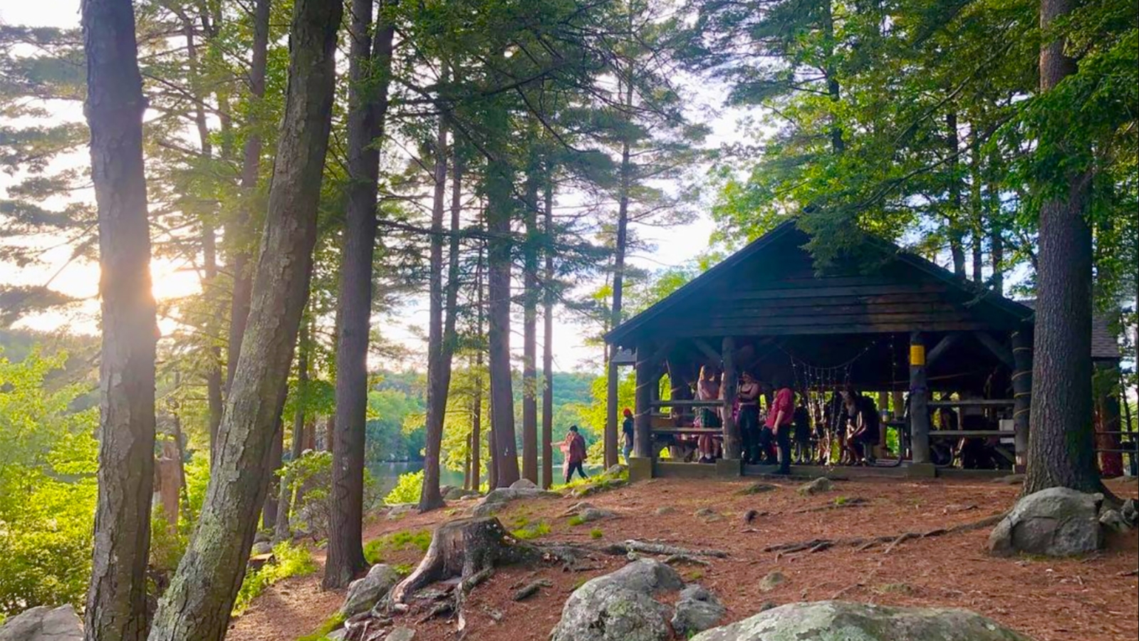 Group enjoying picnic shelter at Burr Pond State Park (Instagram@jspinkmills)