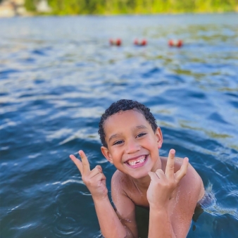 A boy swimming in the water at Indian Well (Instagram@_genesisb)
