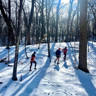 Three people hiking through the winter snow (Instagram@hippiepreppybobohomegirl)