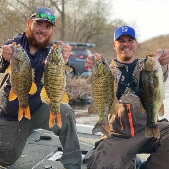 Two men showing their fishing catches at Squantz Pond (Instagram@fishfearme4205)